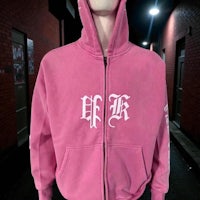 a mannequin wearing a pink zip up hoodie