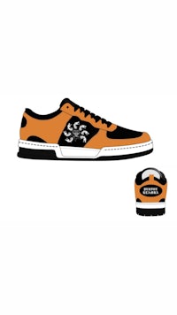 a pair of orange and black shoes with a logo on them